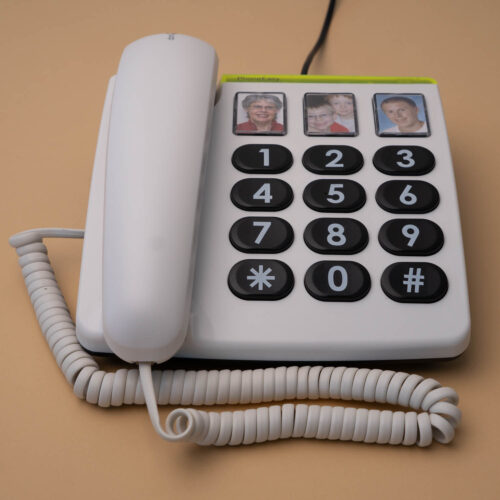 Flaches weißes Telefon Circa 20 x 20 cm groß, Hörer liegt auf der linken Seite auf.